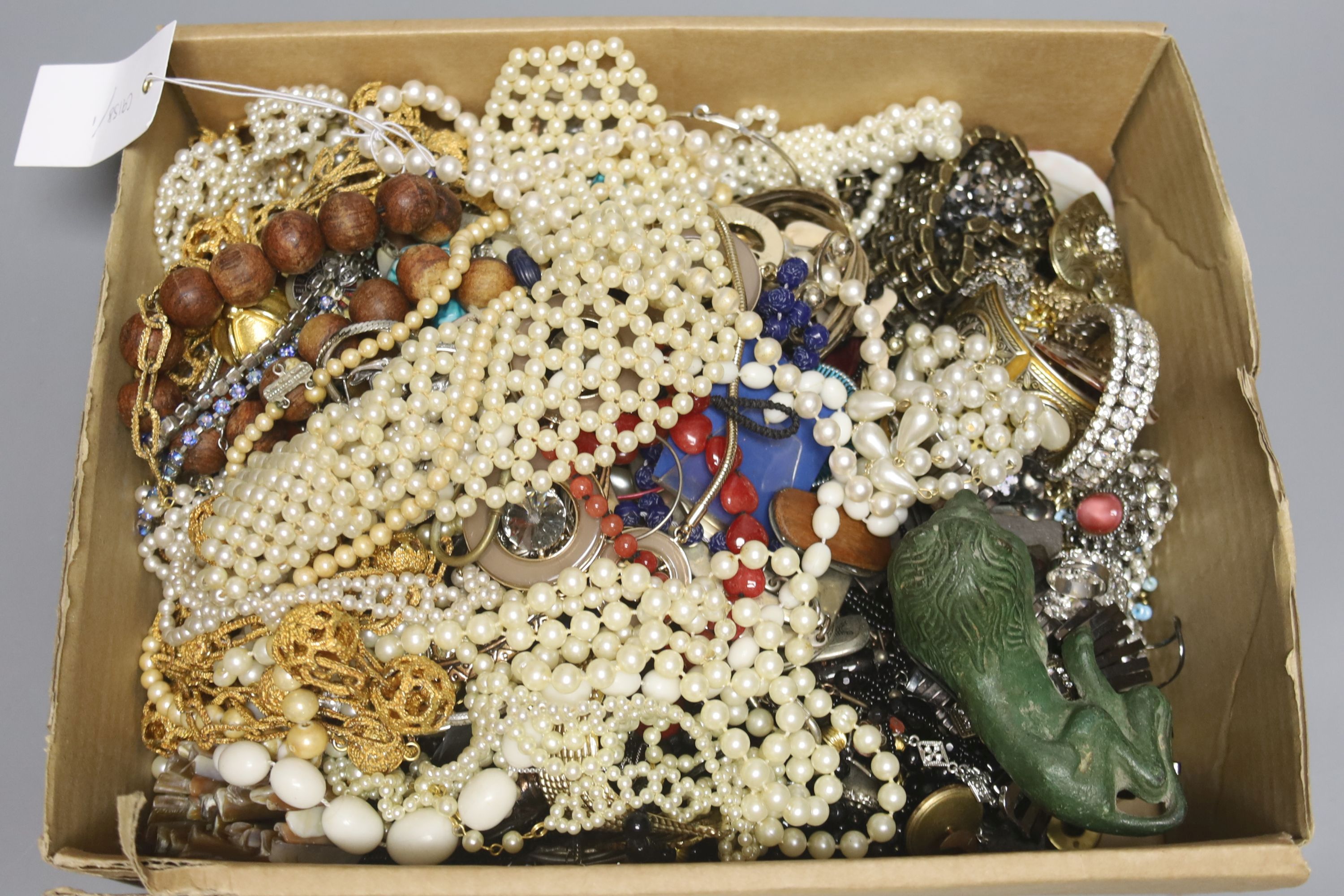 A large quantity of assorted costume jewellery and other items including antimony box and base metal figure of a lion.